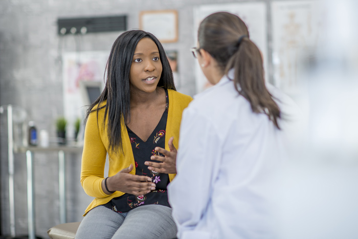 woman talking to a doctor